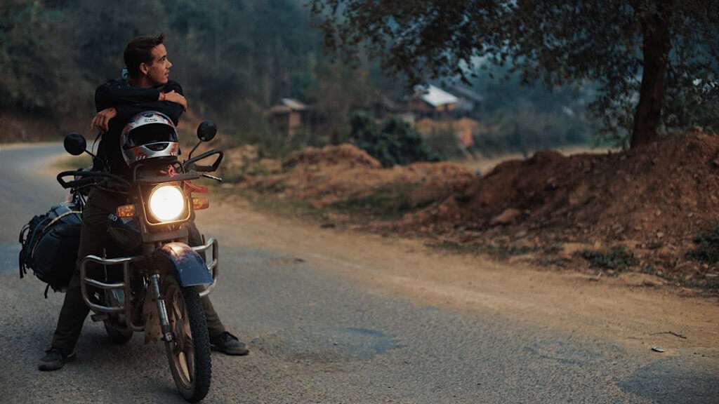 Man on motorcycle thinking