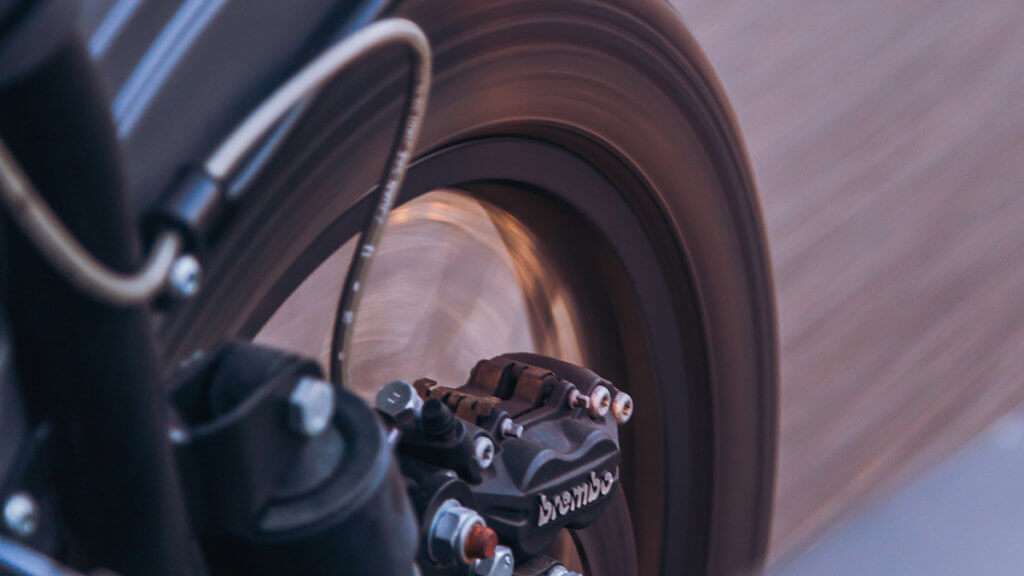 A black motorcycle wheel running