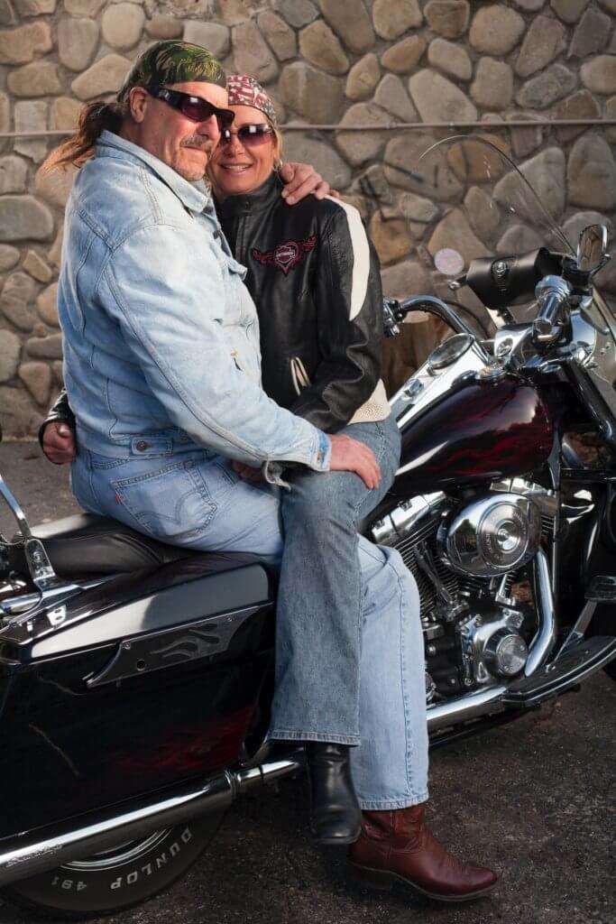 Man and woman sitting together on a motorcycle 