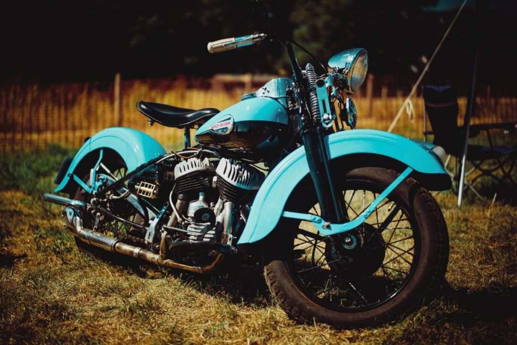 An old blue motorcycle