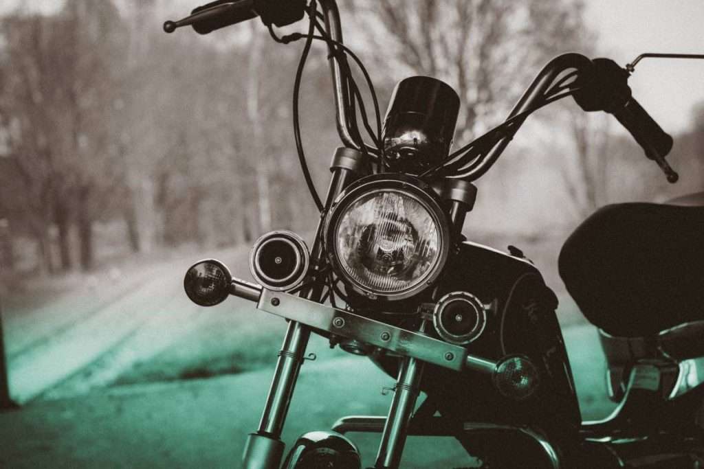 Motorcycle low rider headlight in a black and white photo