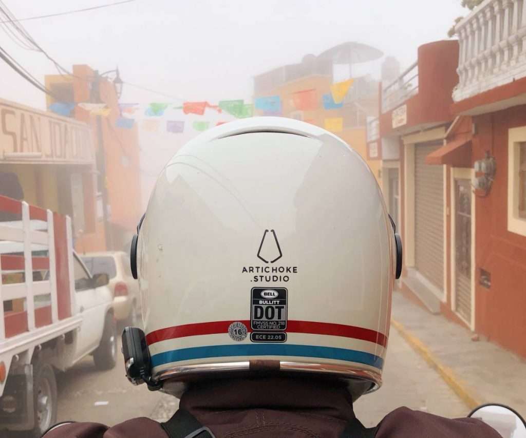 White motorcycle helmet from the back with DOT sticker