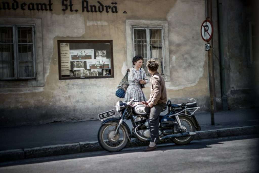 Motorcycle rider stopped on an inclined street